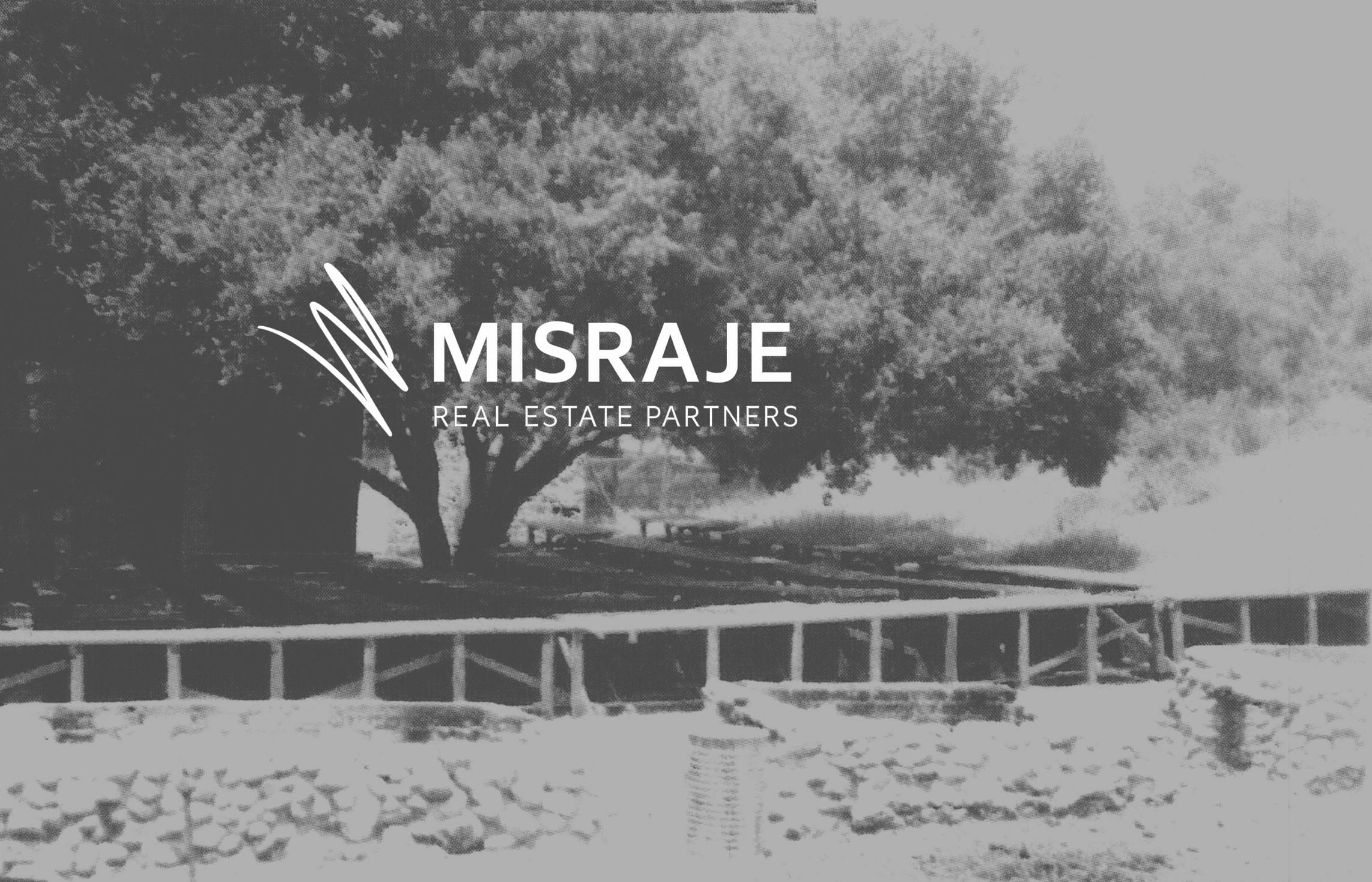 Picnic tables set with seating at a Fryman Ranch barbecue gathering.