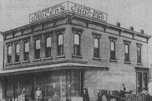The original Ralphs Bros. Grocers store with a horse-drawn delivery wagon, on the site where the Hayward Hotel was later built.